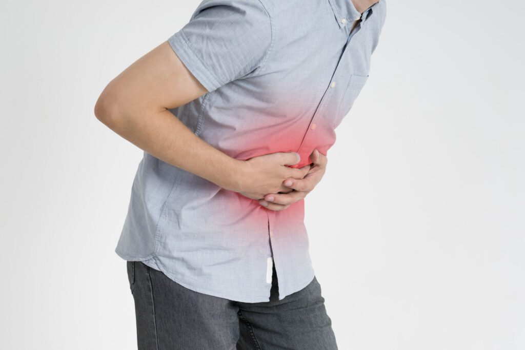 man experiencing abdominal pain