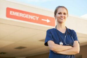 emergency clinic nurse standing infront of an emergency room